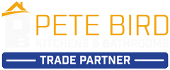 Logo with an orange outline of a house and the text PETE BIRD in orange. Below, a blue rectangle with white text reads TRADE PARTNER, highlighting kitchen and bathroom showroom installation and supply design expertise.