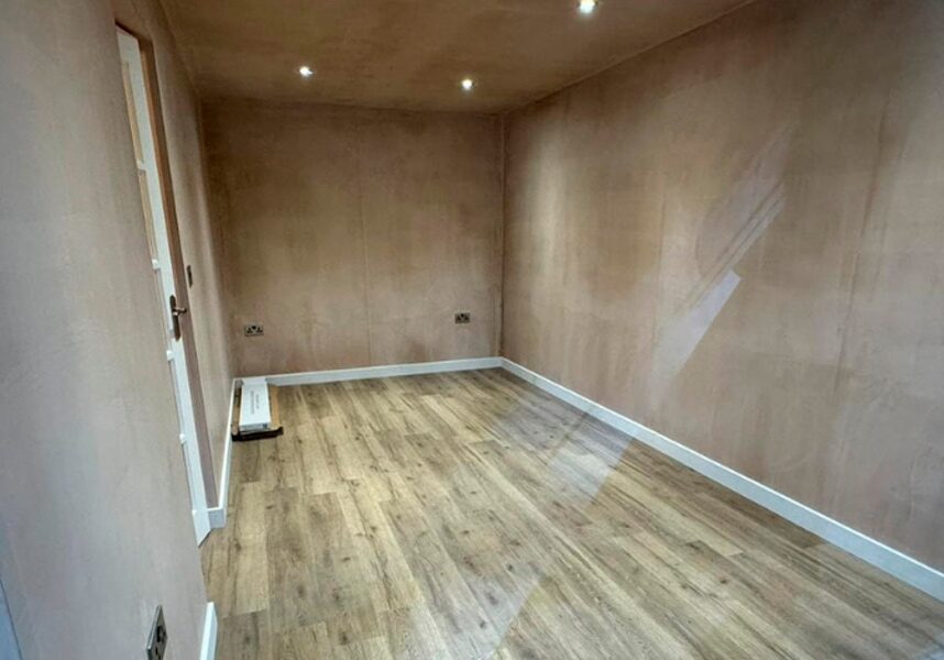 The comfortable and light-filled interior of a modern conservatory, suitable for any season.