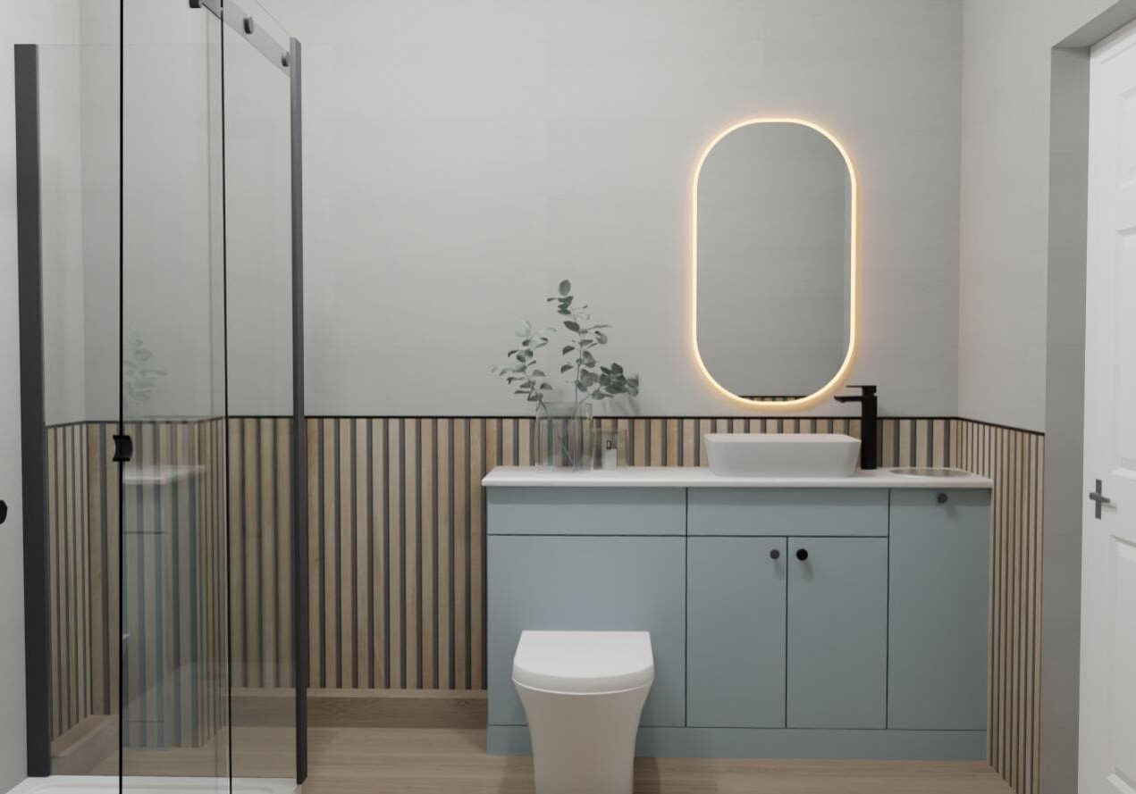 Modern bathroom with a glass shower on the left, a light blue vanity with a vessel basin and black tap, an oval mirror with backlighting, a white toilet, and vertical wood panel accents on the walls.