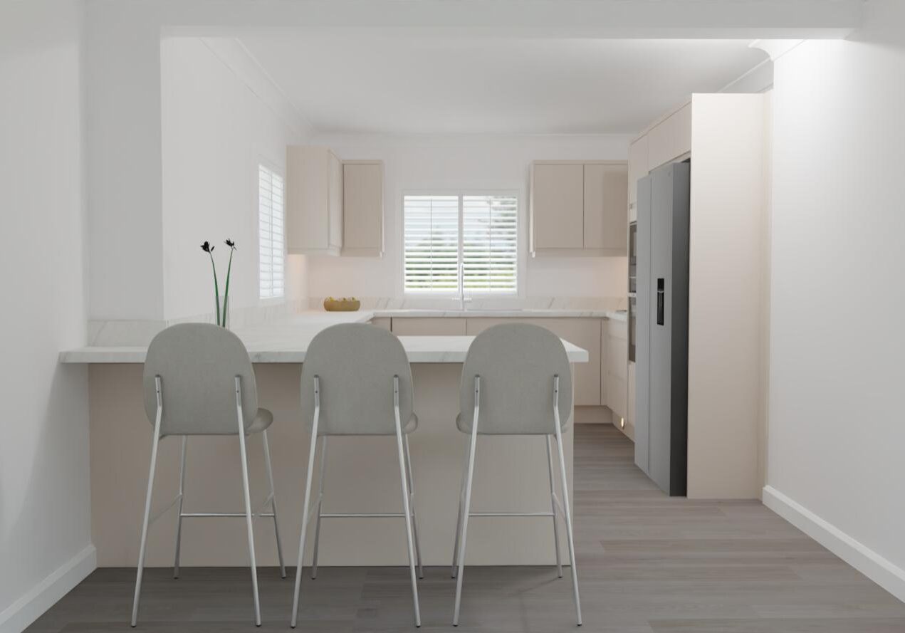 A modern, minimalistic kitchen with light-coloured cabinets, a marble worktop, three grey barstools, a vase with two flowers, a fruit bowl, a large fridge, and windows letting in natural light.